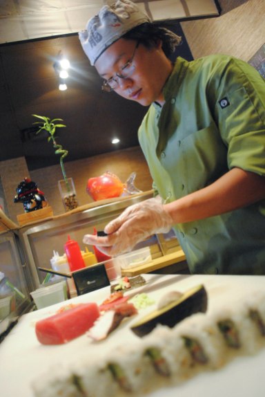 Chef Andy Himawan prepares sashimi in his Middleburg restaurant, Sushi Bistro. The small-town restaurant could see an upsurge in business as St. Vincent's Clay County Campus prepares to open across the street Oct. 1. (Christina Kelso/ The Florida Times-Union)