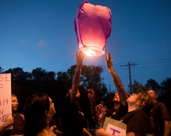 Family and friends of 16-year-old Dalton Kuhn light and release purple lanterns into the sky on Tuesday, October 10, 2017, while gathered on the side of State Road 312 on the one-year anniversary of his death. Purple was the teenager’s favorite color. Investigators with the St. Augustine Police Department believe that Kuhn was hit and killed by a white Chevy 2500 diesel pickup truck between the model years 2003 and 2006, while walking or skateboarding alongside the road. The driver did not stop and has not come forward. Anyone with information about the case is asked to call Detective Sergeant Jason Etheredge at 825-1092. Those who wish to remain anonymous can call Crime Stoppers of Northeast Florida at 888-277-8477. (Christina Kelso/ The St. Augustine Record)