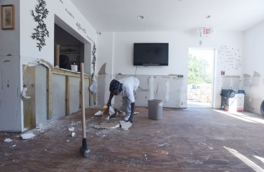 Don White, maintenance worker for Grafton House assisted living facility on Marine Street, removes flood damaged drywall from the building's interior on Wednesday October 19, 2016. With little of the ground floor salvageable and an estimated four to six months of repairs ahead, the Grafton House's 16 residents have had to find new homes in the wake of Hurricane Matthew. (Christina Kelso/ The St. Augustine Record)